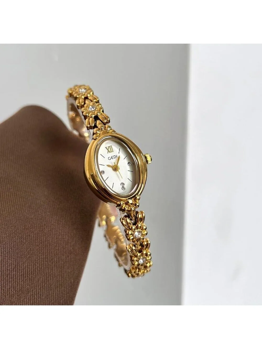 Women Gold And White Analog Quartz Alloy Steel Oval Roman Numeral Bracelet Watch